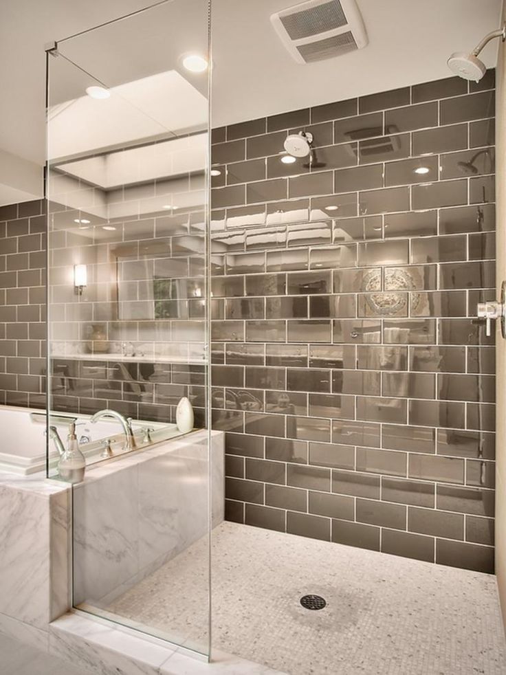 Grey subway tile bathroom with a vintage shower head