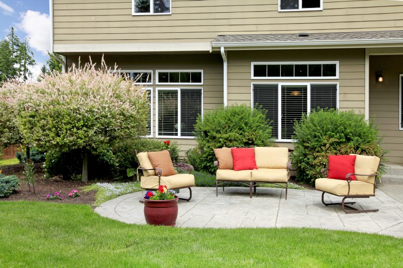 backyard sitting area with sofas and chairs