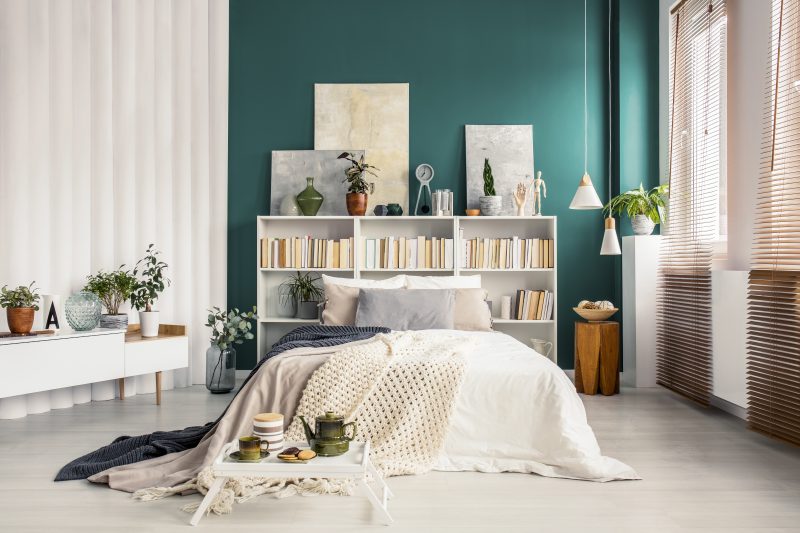 turquoise green bedroom interior with Bookcase headboard