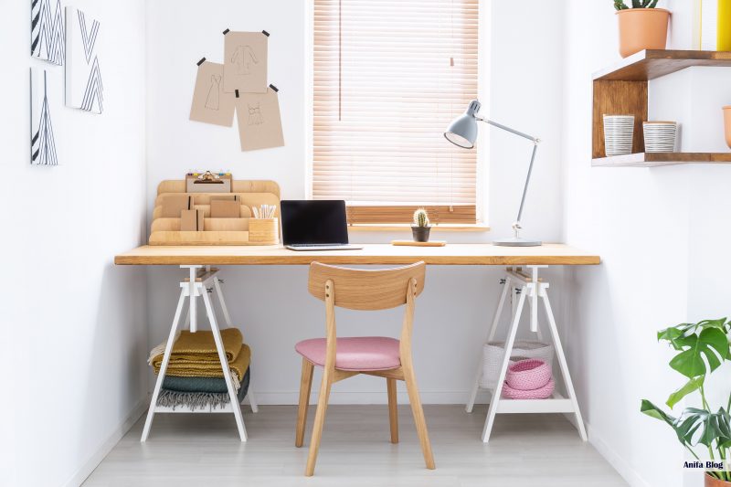 small office room with wooden desk in a white
