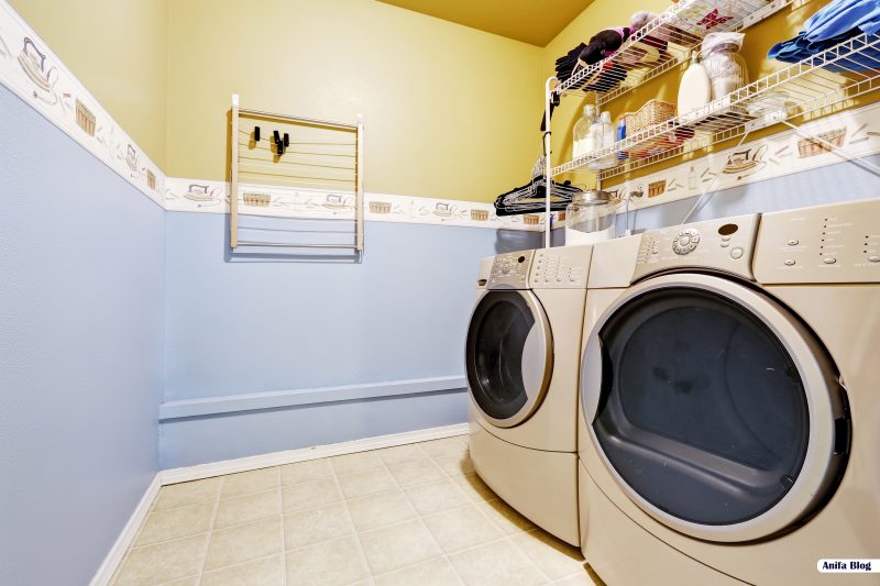Laundry room interior in light blue and yellow