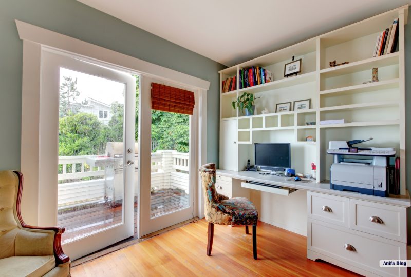 Home office with white open shelves