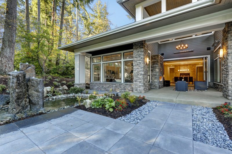  stone home exterior with front patio